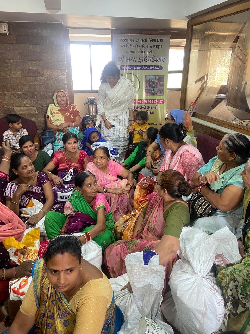 Women receiving monthly family ration kits